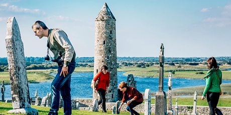 Tourists exploring Clonmacnoise Monastic Settlement